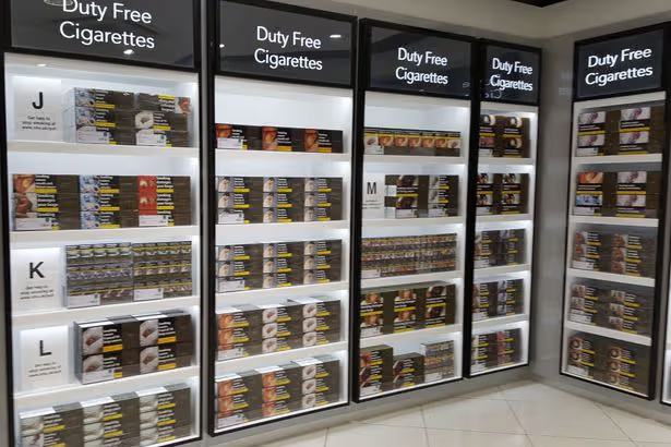 Cigarette cartons displayed in an airport duty-free tobacco shop